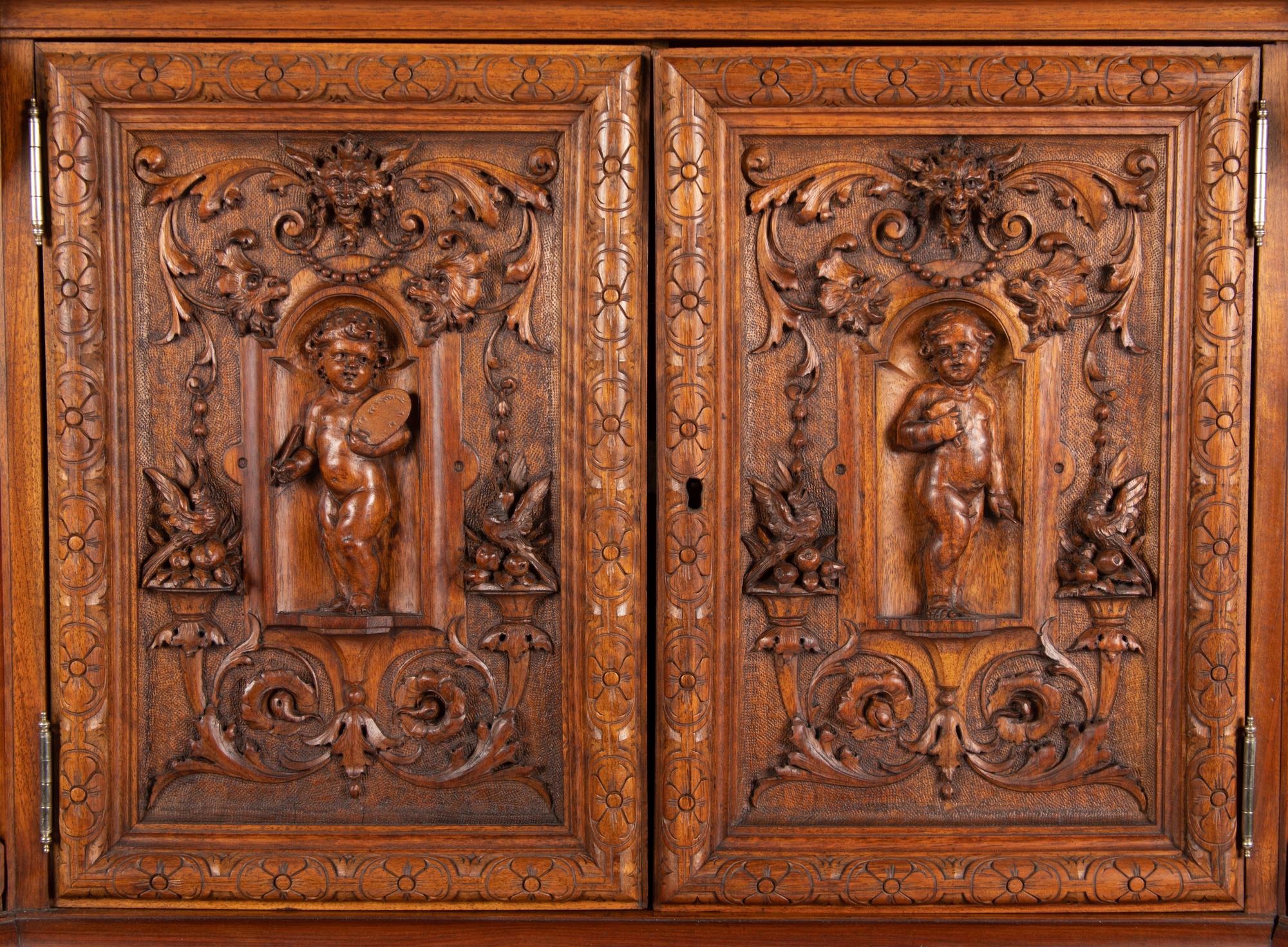 A Renaissance Revival Carved Walnut Cabinet In the Manner of Alexander Roux