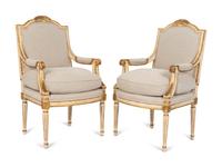 A Pair of Louis XVI Style Painted and Parcel Gilt Fauteuils — EARLY 20TH CENTURY