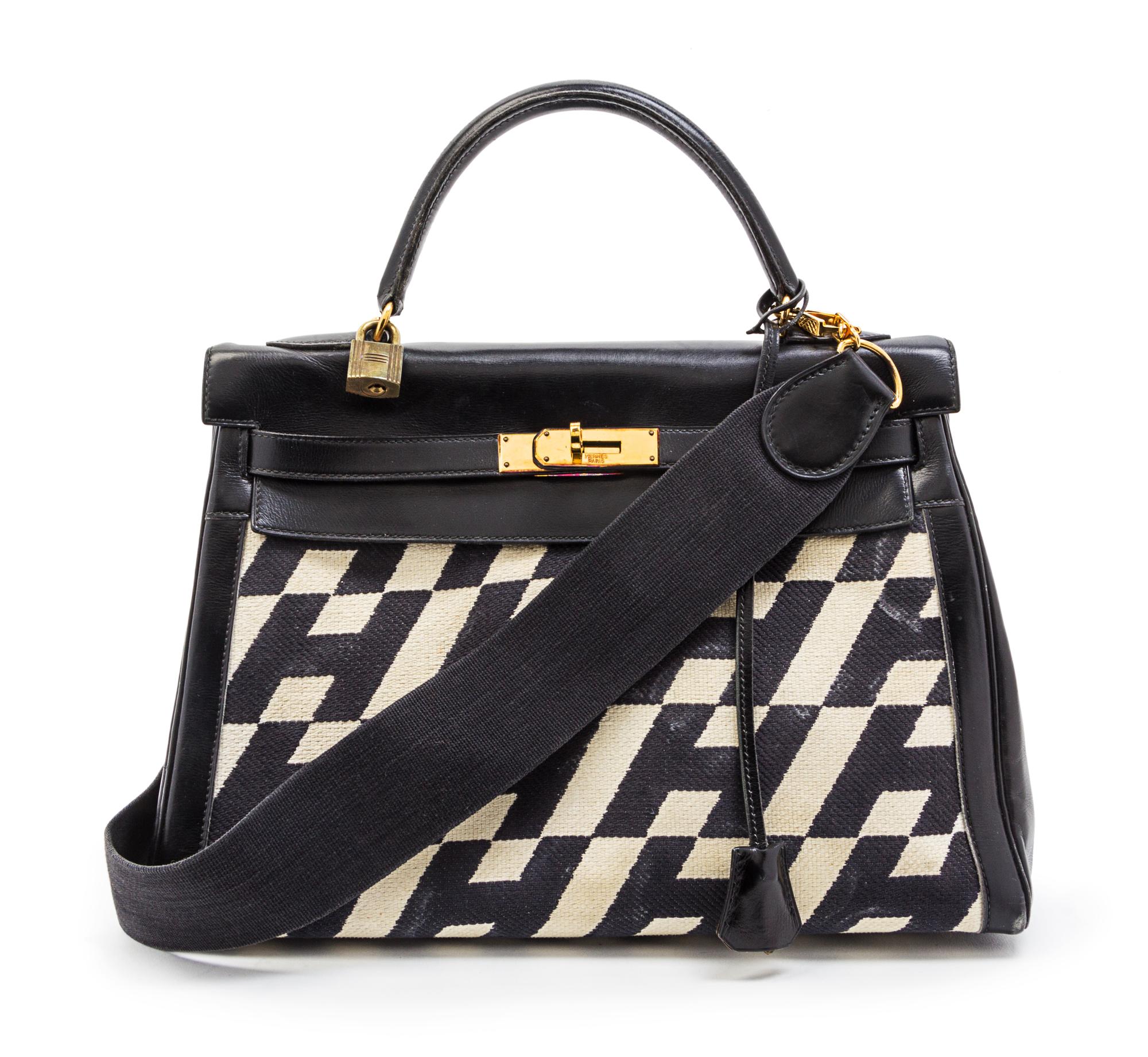 A Rare Hermes 35cm Ulysses Black Leather and Ivory Canvas Kelly Bag, 13 x 9 x 5 inches.