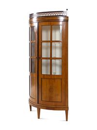 A Biedermeier Parcel Ebonized Fruitwood Corner Cupboard