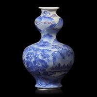 A Japanese Blue and White and Copper Red Glazed Double Gourd 'Landscape' Vase, Signed Dai Nihon Kozan sei