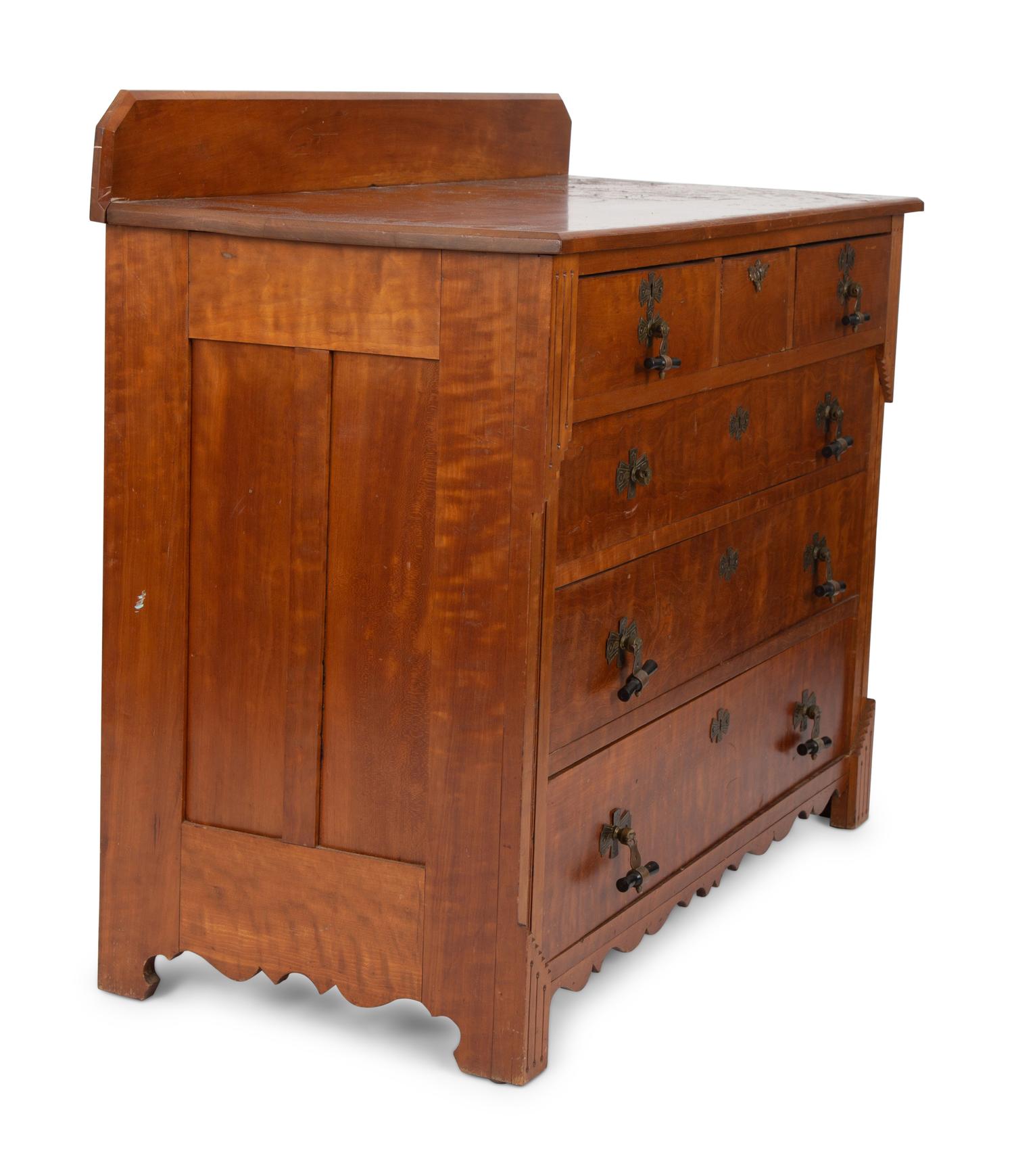 A Victorian Eastlake Aesthetic Flame Cherry Chest of Drawers — EARLY 20TH CENTURY