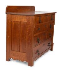 A Victorian Eastlake Aesthetic Flame Cherry Chest of Drawers — EARLY 20TH CENTURY