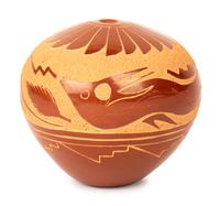Red Seed Jar, with shallow carvings resembling birds