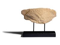 An Egyptian Painted Limestone Relief Fragment