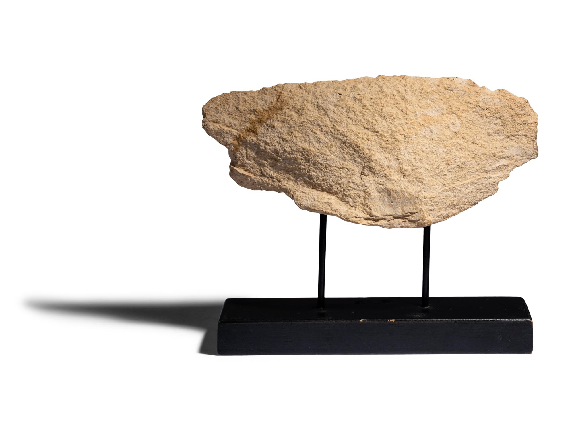 An Egyptian Painted Limestone Relief Fragment