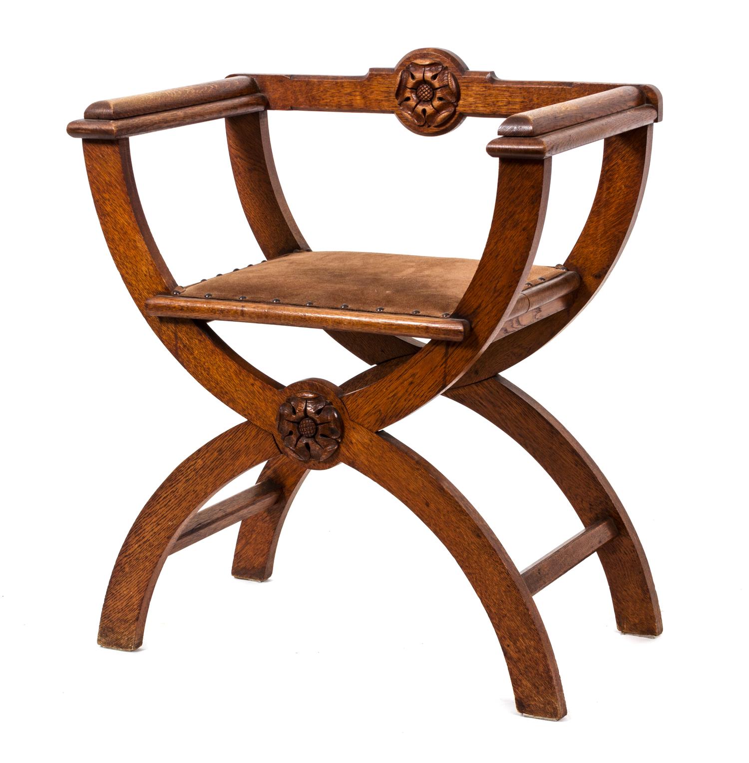 An English Arts & Crafts Carved Oak Savanarola Chair Height 31 1/2 inches. — LATE 19TH CENTURY