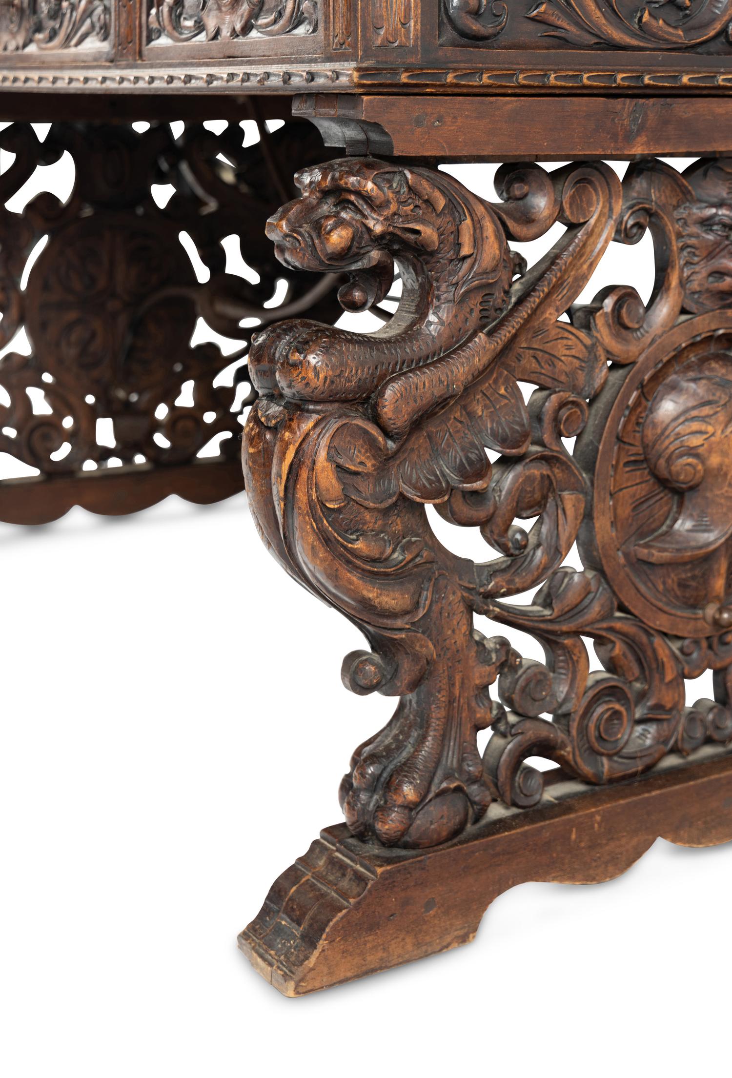 A Renaissance Revival Iron-Mounted Carved Walnut Library Table