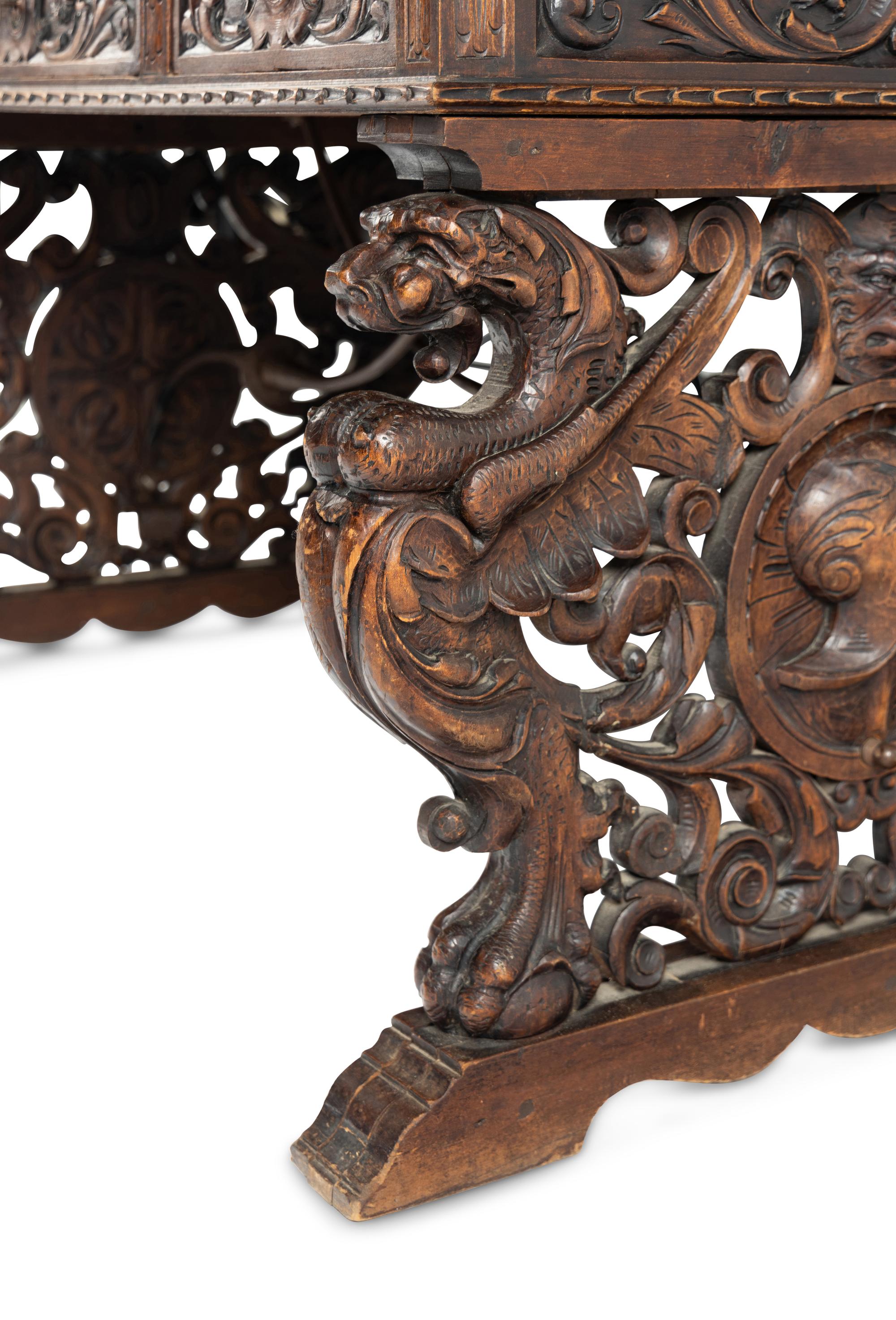 A Renaissance Revival Iron-Mounted Carved Walnut Library Table