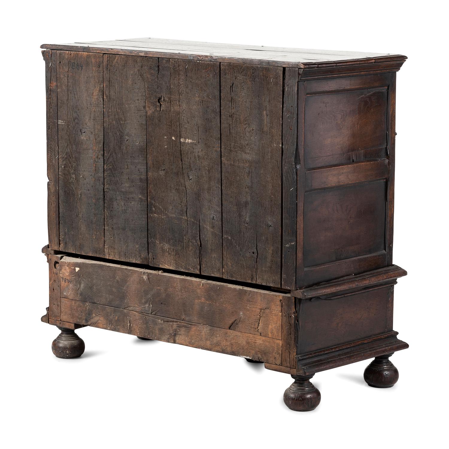 A Flemish Paneled and Molded Oak Chest of Drawers