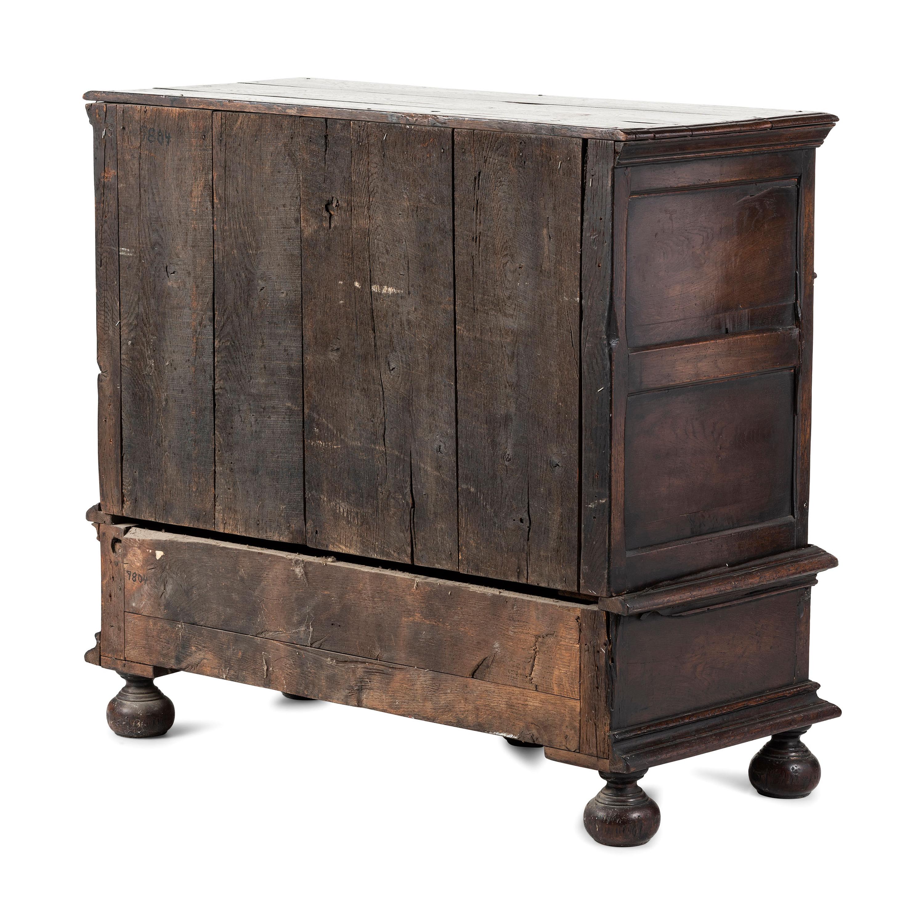 A Flemish Paneled and Molded Oak Chest of Drawers
