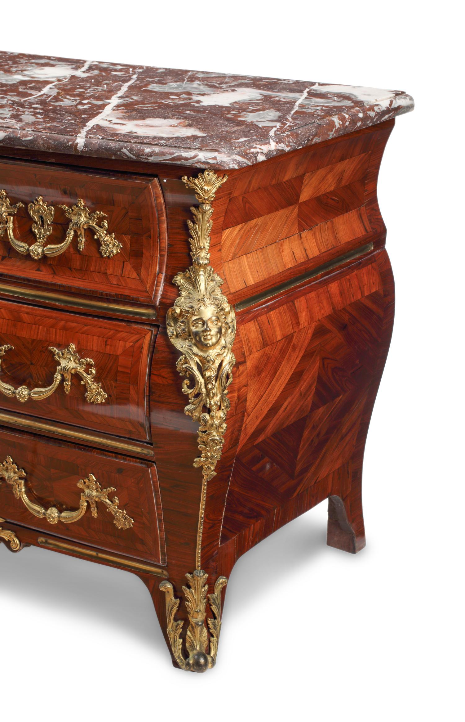 A Régence Gilt Bronze Mounted Marquetry Marble-Top Commode