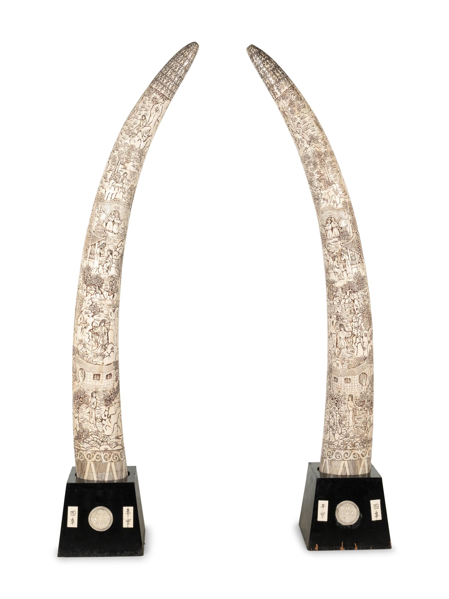 A Pair of Large Carved Bone Veneered Models of Tusks