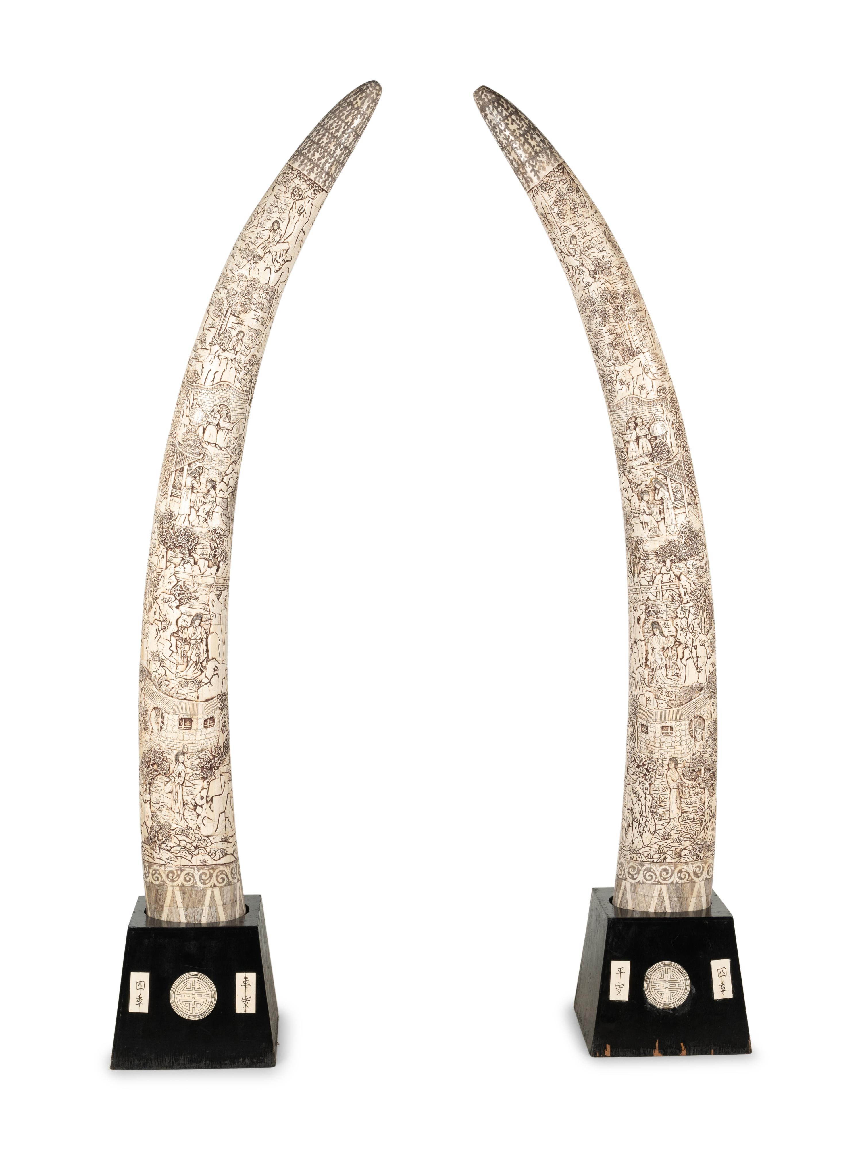 A Pair of Large Carved Bone Veneered Models of Tusks