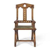 A Gothic Revival Patent Gothic Star Walnut Arm Chair