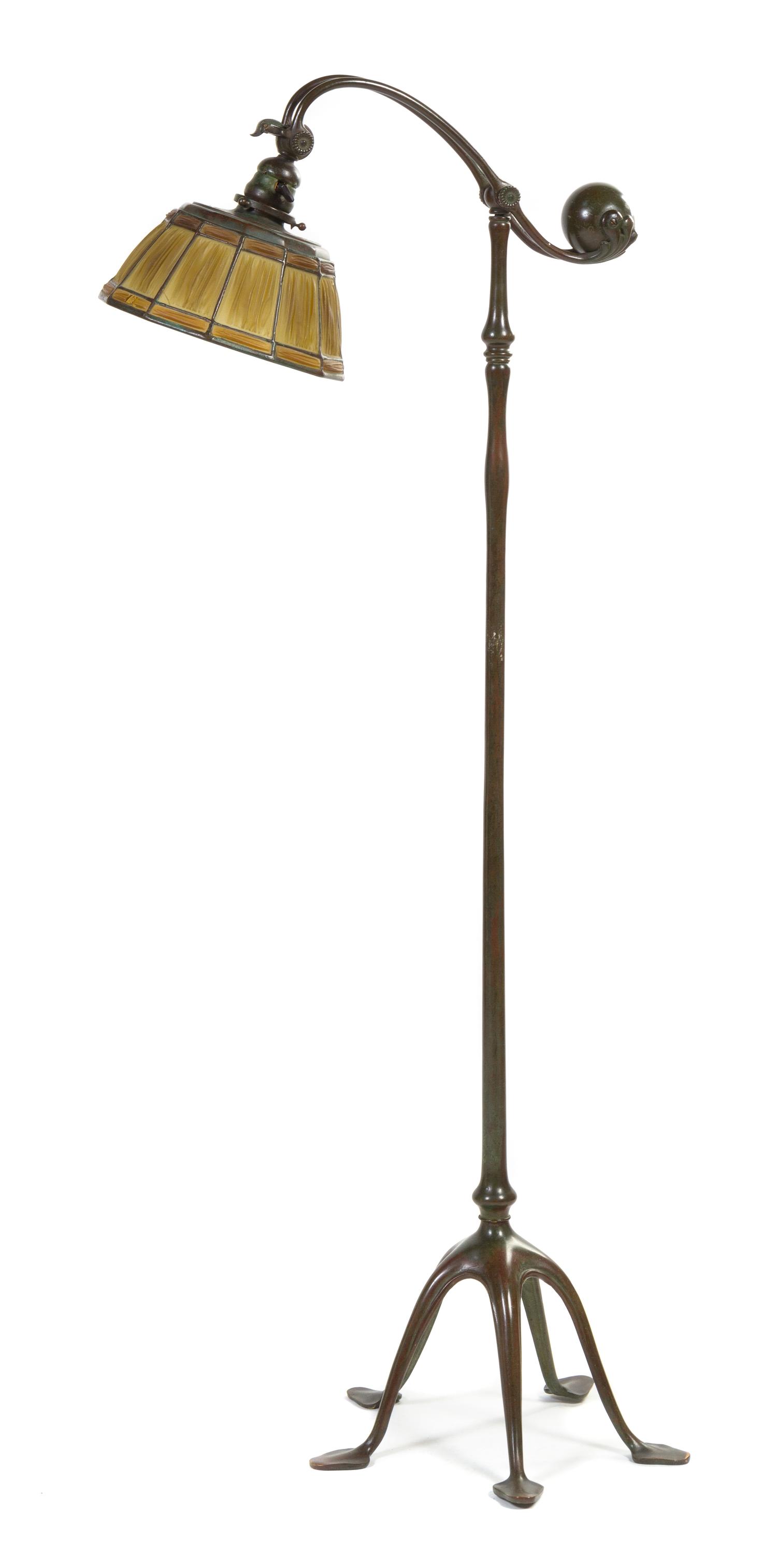 A Tiffany Studios Favrile Glass and Bronze Counter Balance Linen Fold Floor Lamp Diameter of shade 9 1/4 inches, height overall 51 1/4