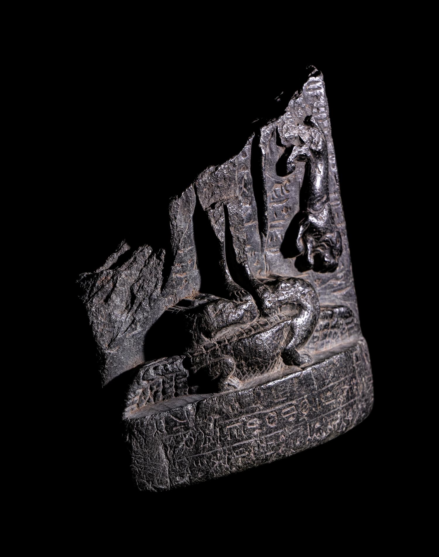 An Egyptian Black Steatite Cippus Fragment