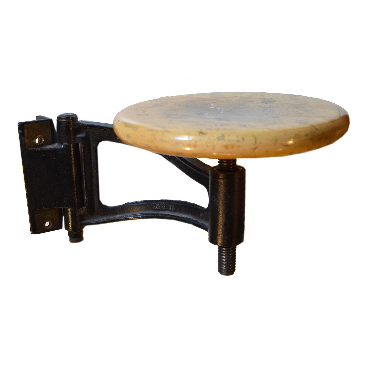 An Iron and Wood Swing Arm Stool 19.5" W x 10 " D x 12" H — United States, Circa 1930