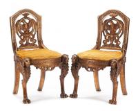A Pair of Continental Carved Side Chairs Height 36 1/2 inches. — 19TH CENTURY