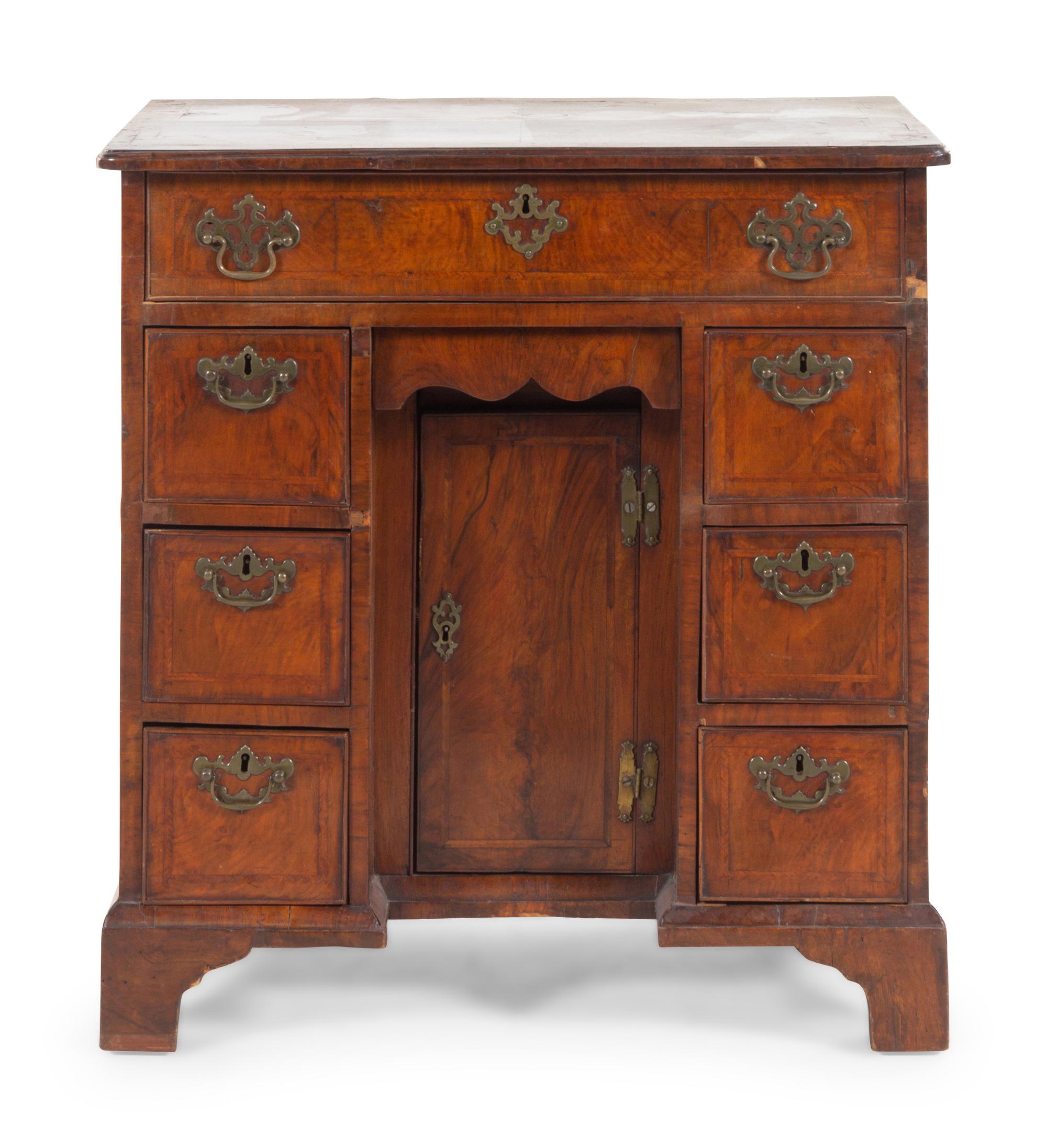 A George II Walnut Kneehole Desk