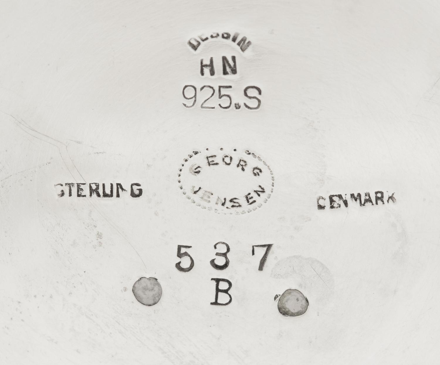 A Pair of Harald Nielsen for Georg Jensen Silver Three-Light Candelabra