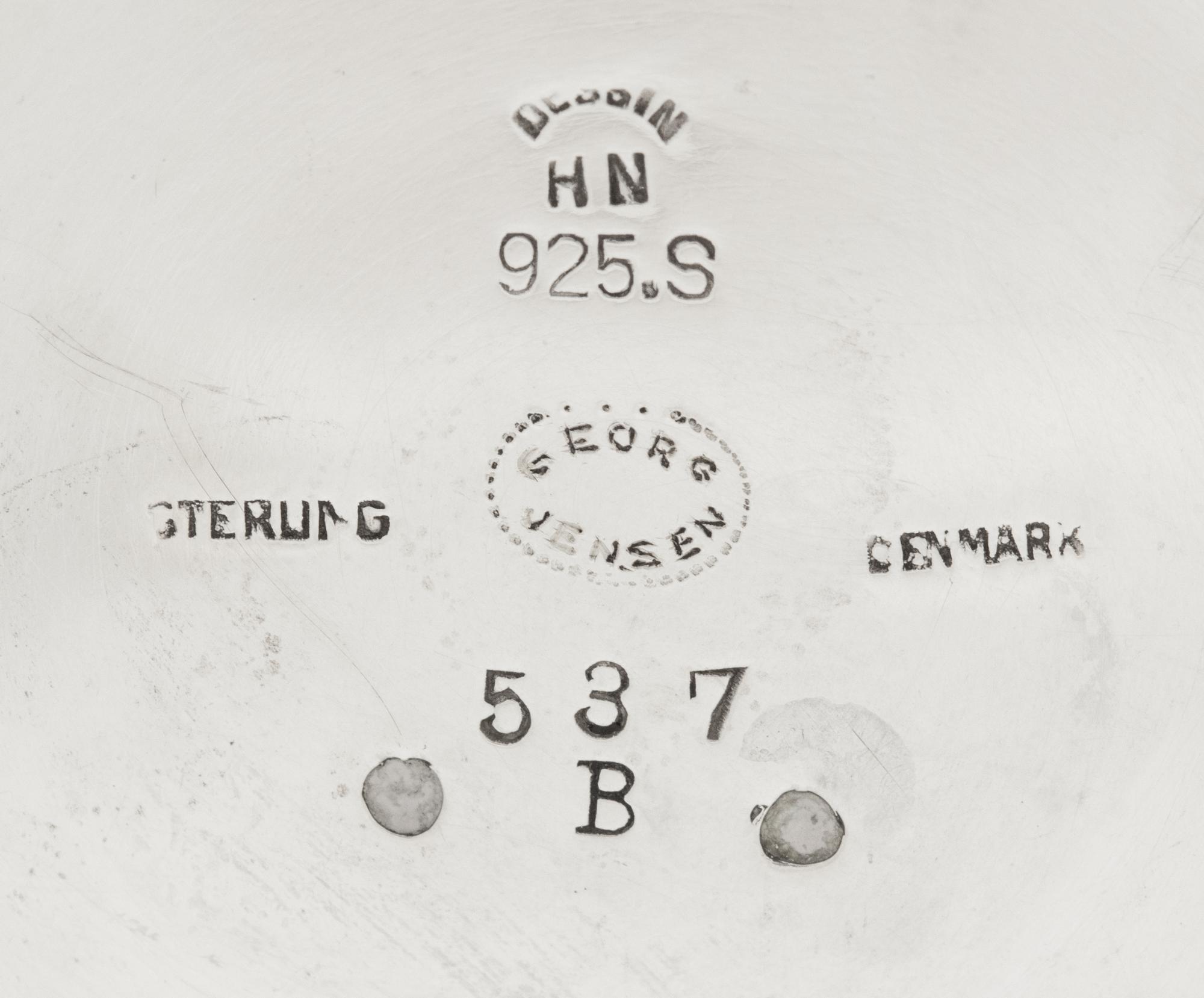 A Pair of Harald Nielsen for Georg Jensen Silver Three-Light Candelabra