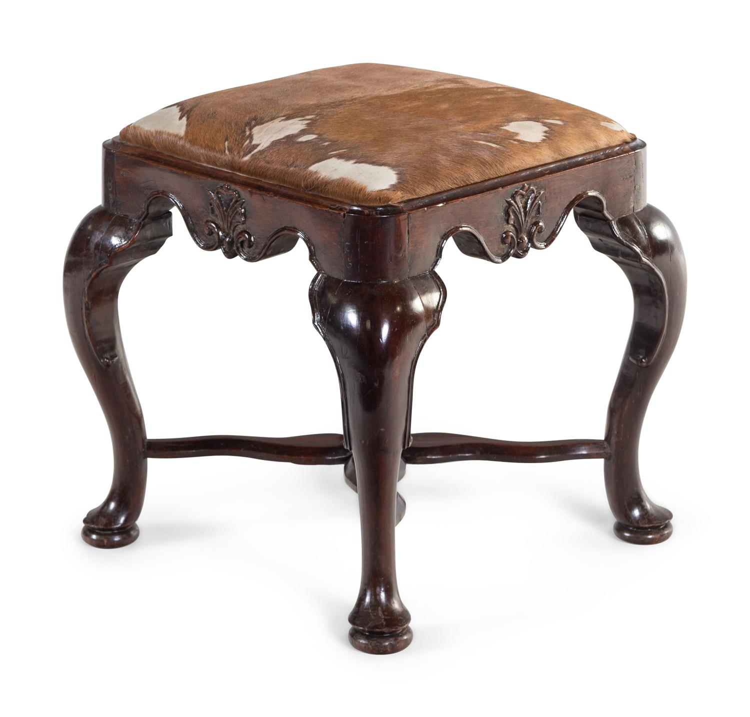 A George II Carved Walnut Footstool with Cowhide Upholstery