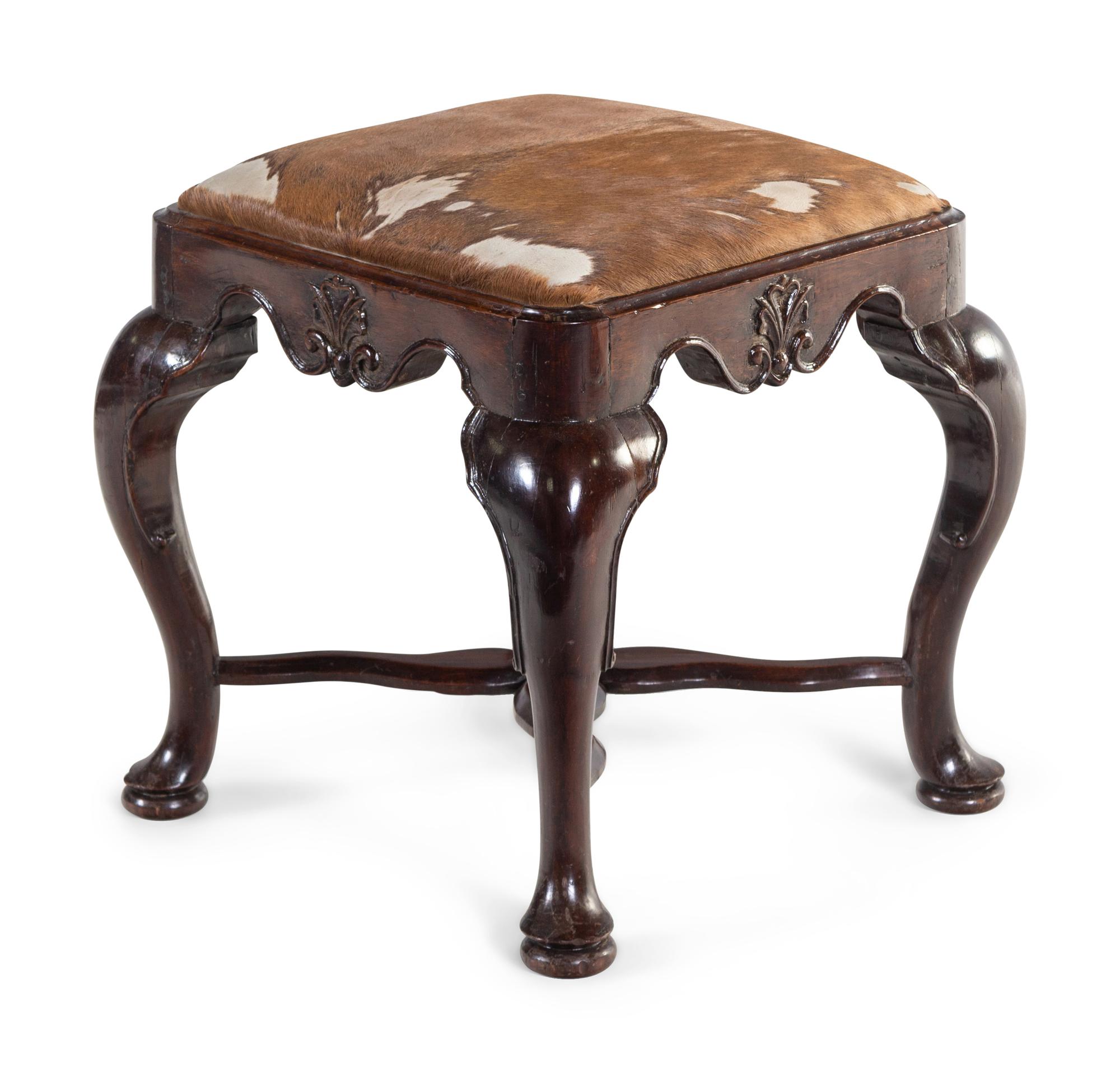 A George II Carved Walnut Footstool with Cowhide Upholstery