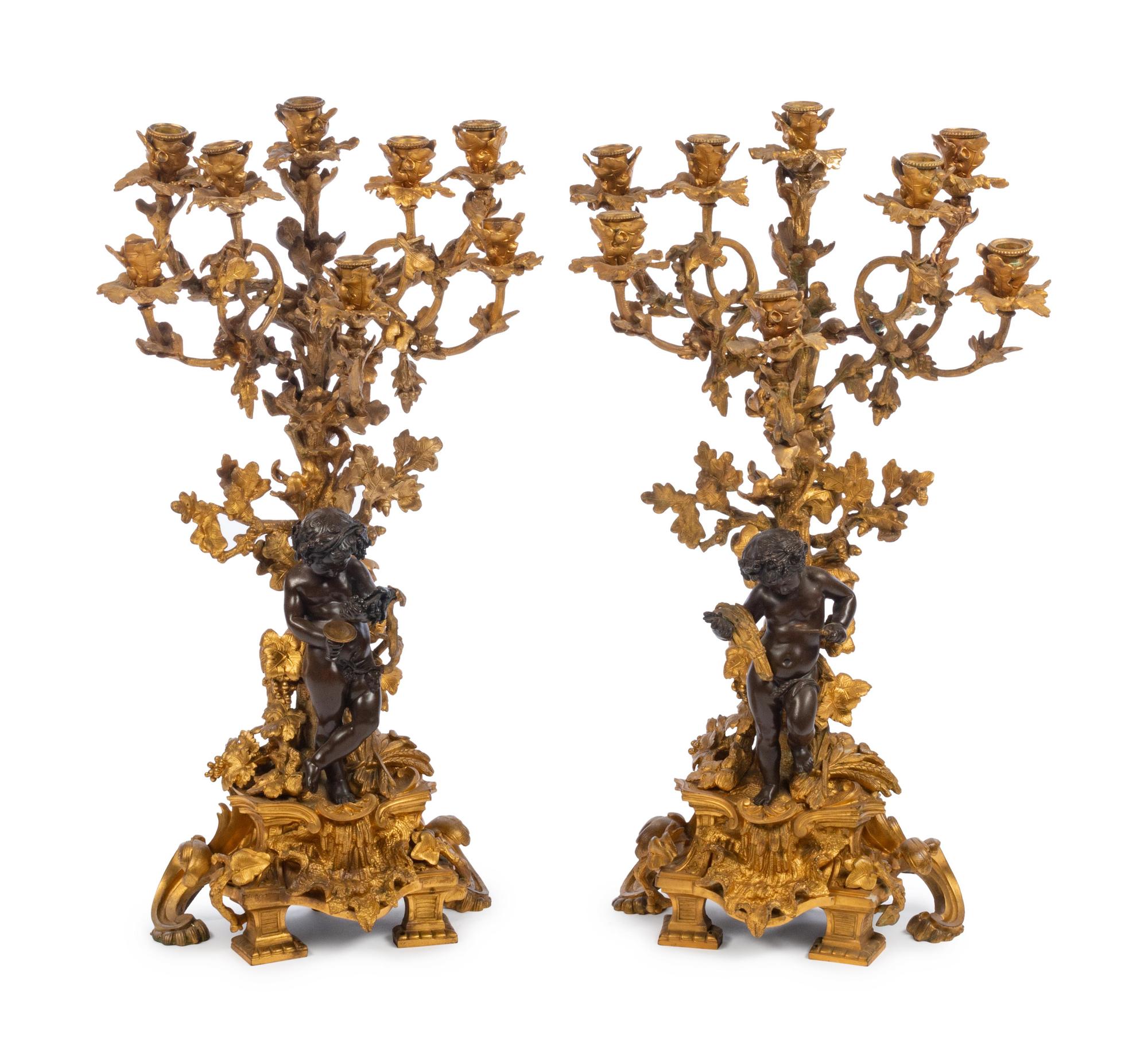 A Pair of French Gilt and Patinated Bronze Eight-Light Figural Candelabra