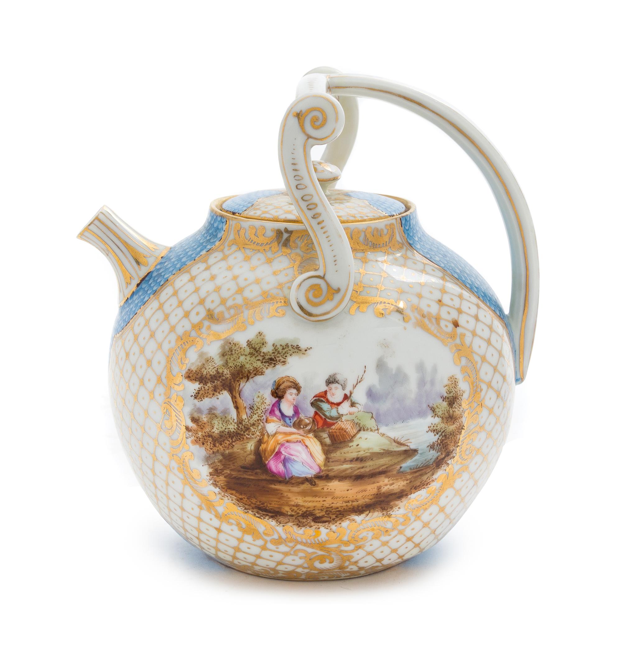 A Continental Porcelain Teapot Height 9 inches.