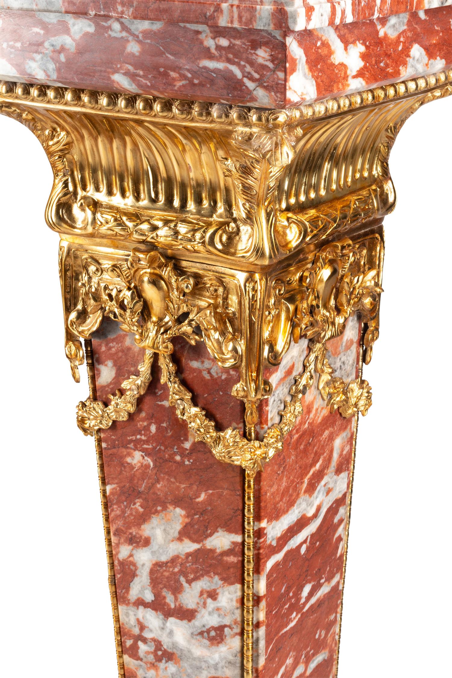 A Pair of Continental Gilt Bronze Mounted Rouge Marble Pedestals