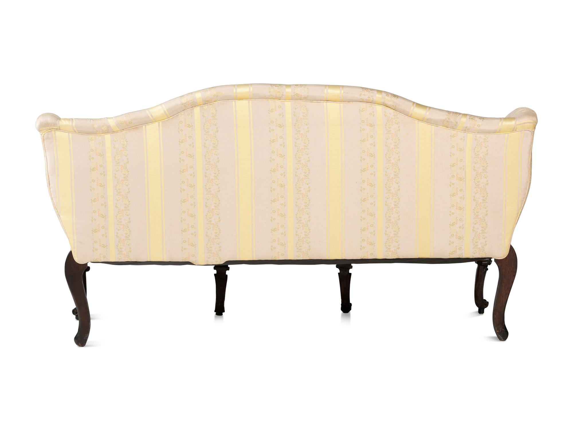 An Italian Carved and Black Painted Walnut Upholstered Sofa