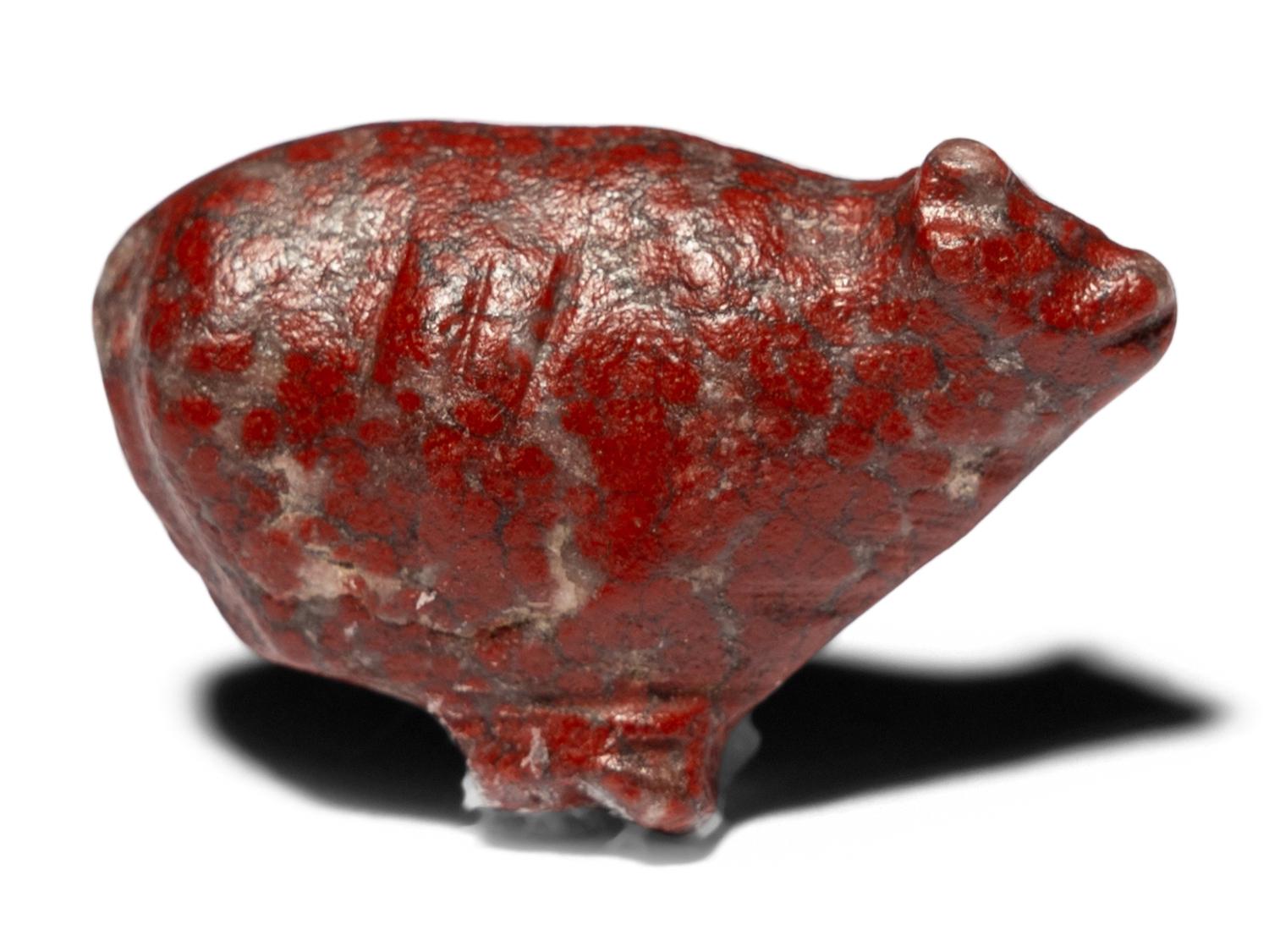 An Egyptian Red Jasper Trussed Ox
