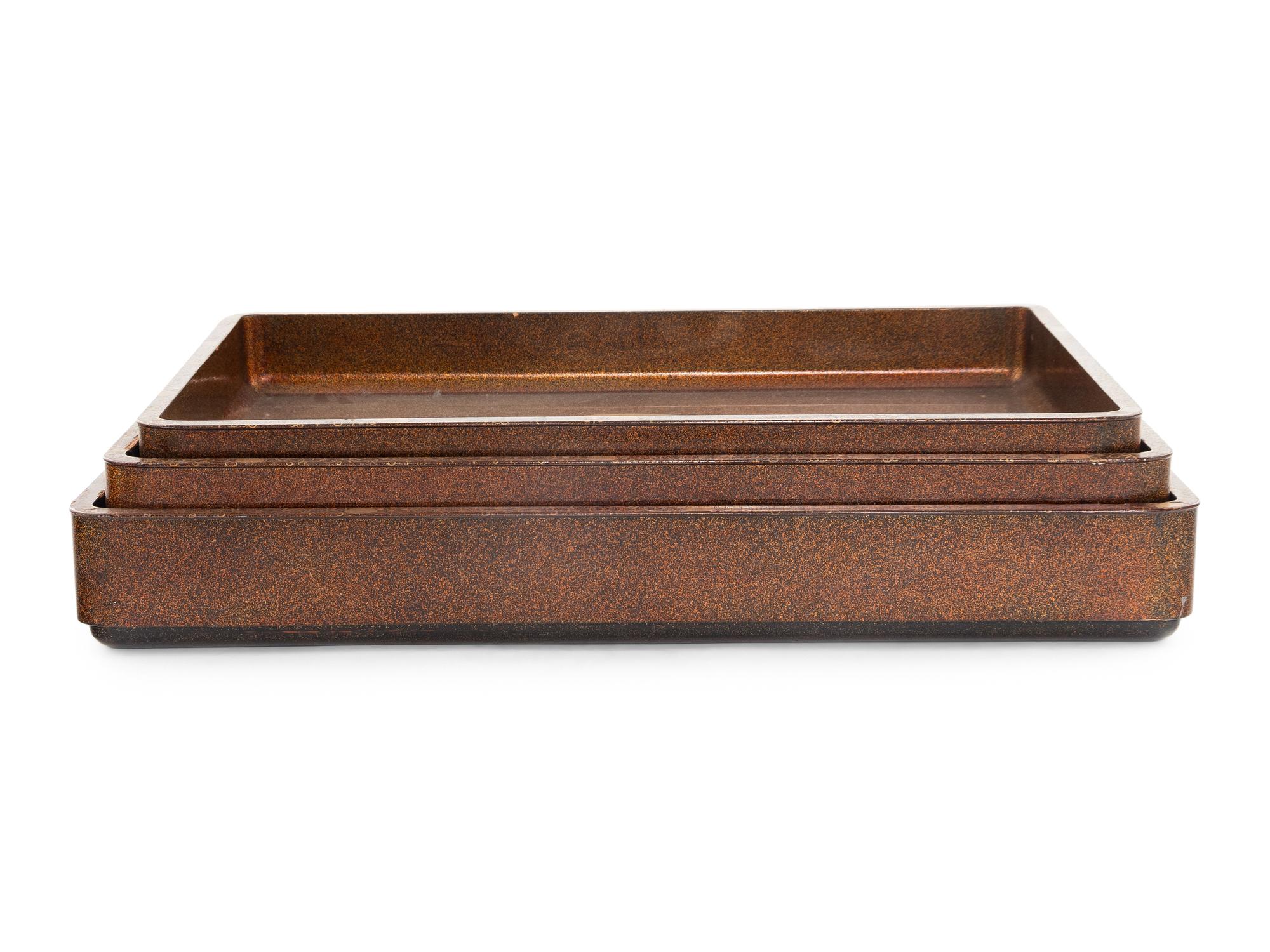 A Set of Three Japanese Maki-e Lacquered Rectangular Trays