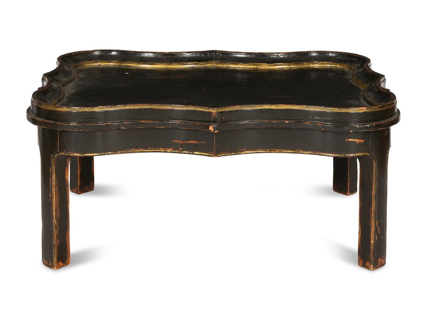 A Cartouche-Form Ebonized and Parcel Gilt Low Table