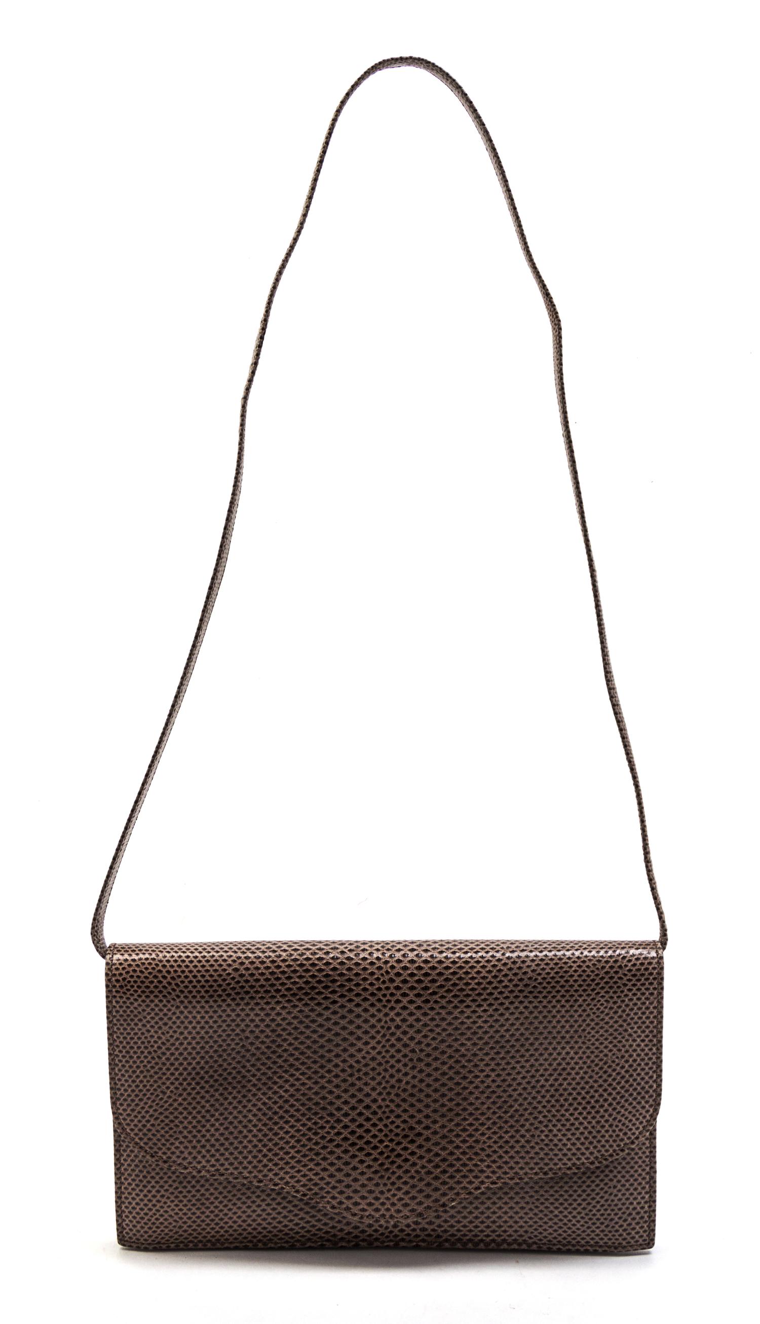 An Hermes Taupe Lizardskin Convertible Clutch, 8 1/2 x 5 x 1 inches.