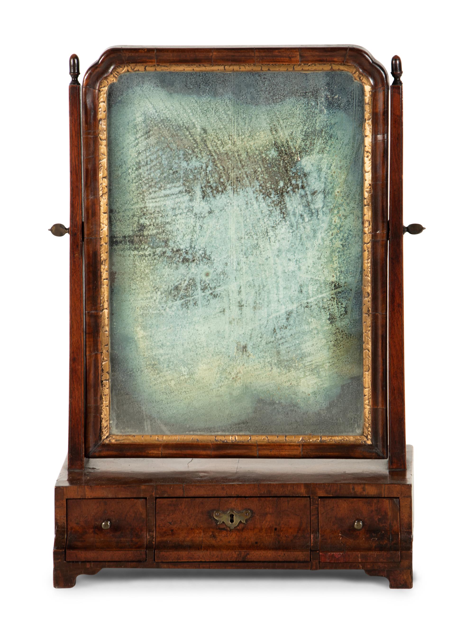 A George II Parcel Gilt Walnut Dressing Mirror