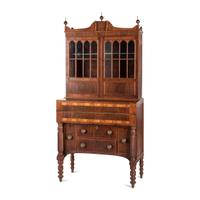 A Classical Figured Maple and Mahogany Desk-and-Bookcase