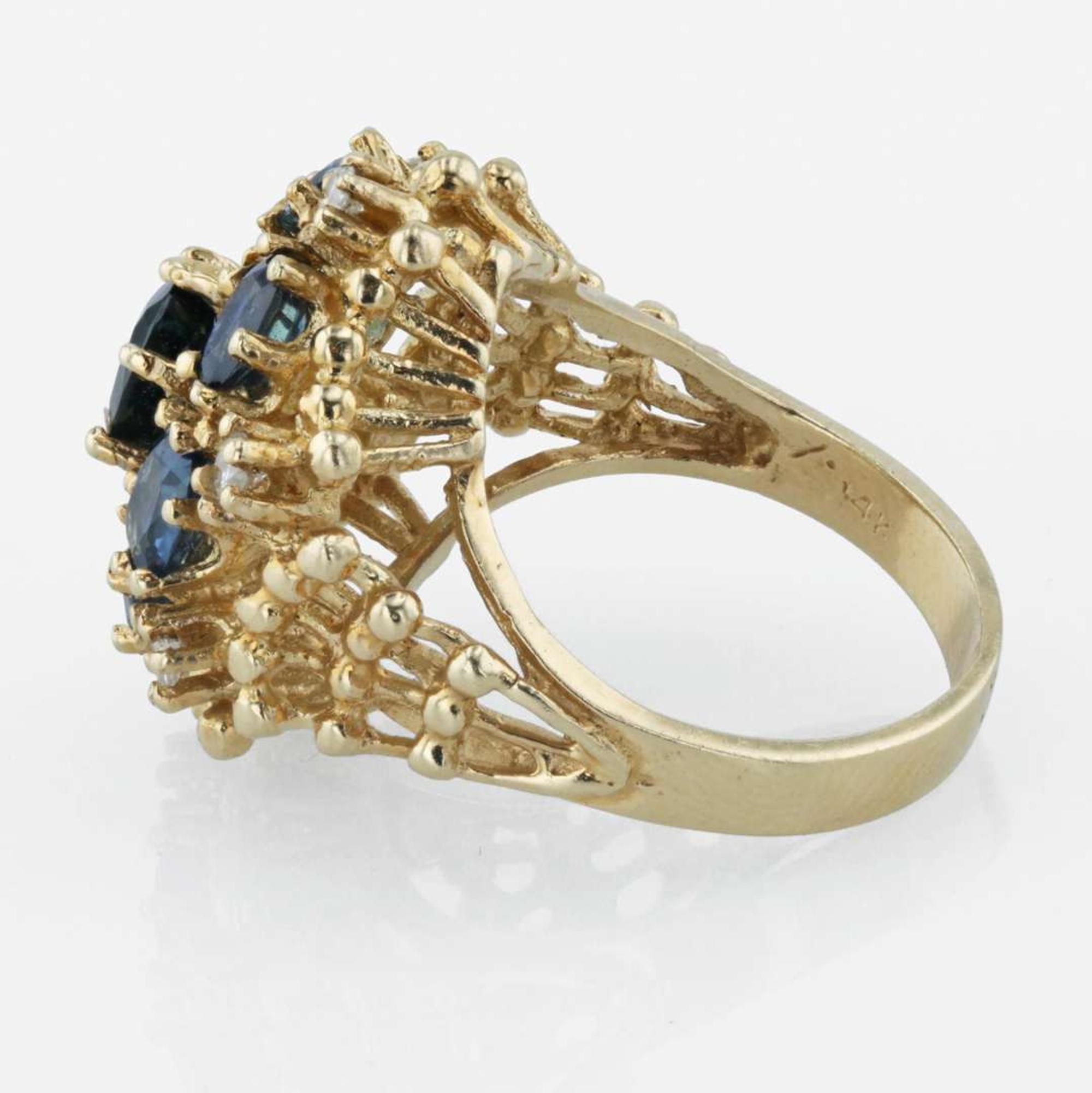 A 14K yellow gold, sapphire, and diamond ring