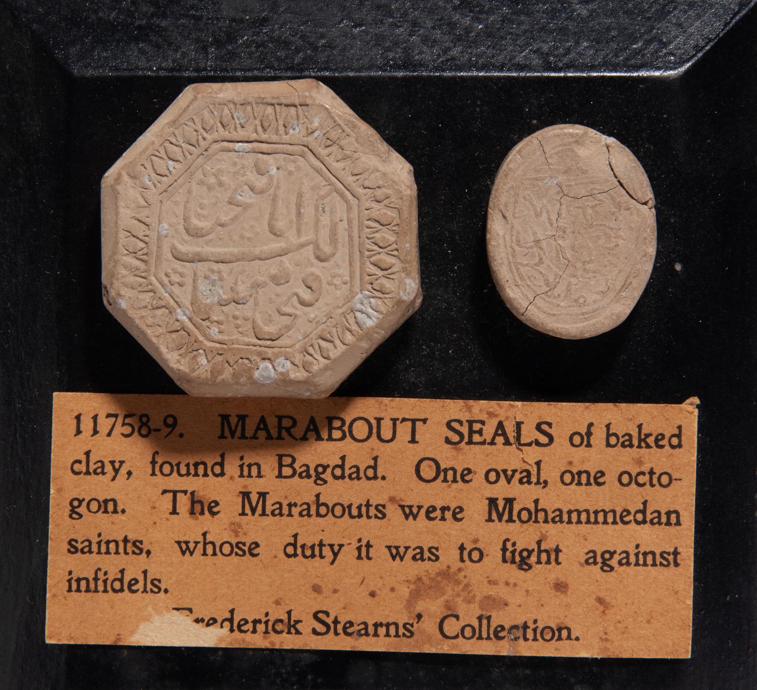 Two Islamic Pottery Turbahs or Seals Mounted on a Plaque
