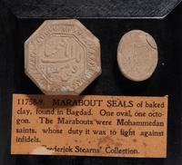 Two Islamic Pottery Turbahs or Seals Mounted on a Plaque