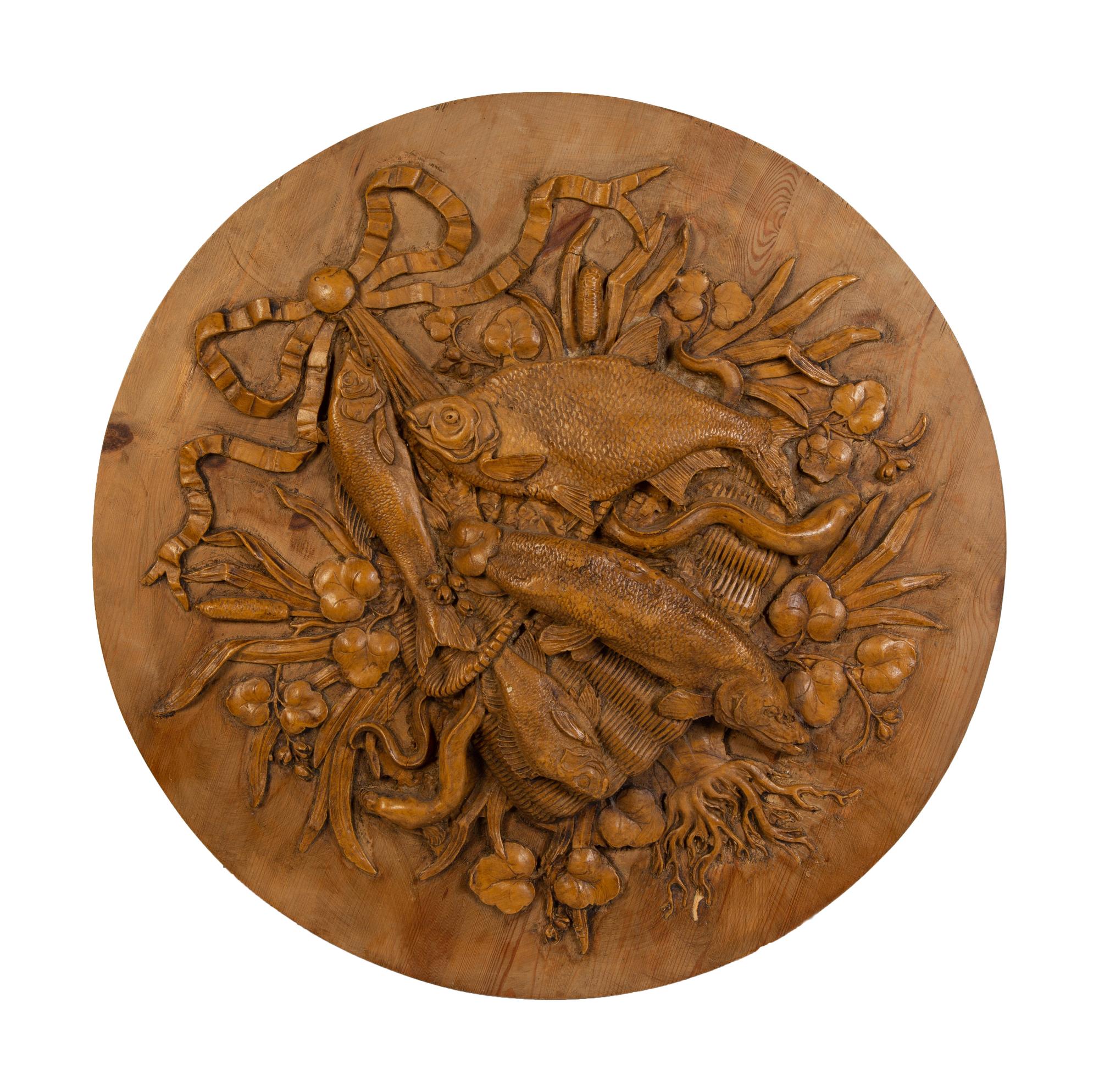 A Pair of Continental Carved Game Plaques Depicting Fish — 20TH CENTURY