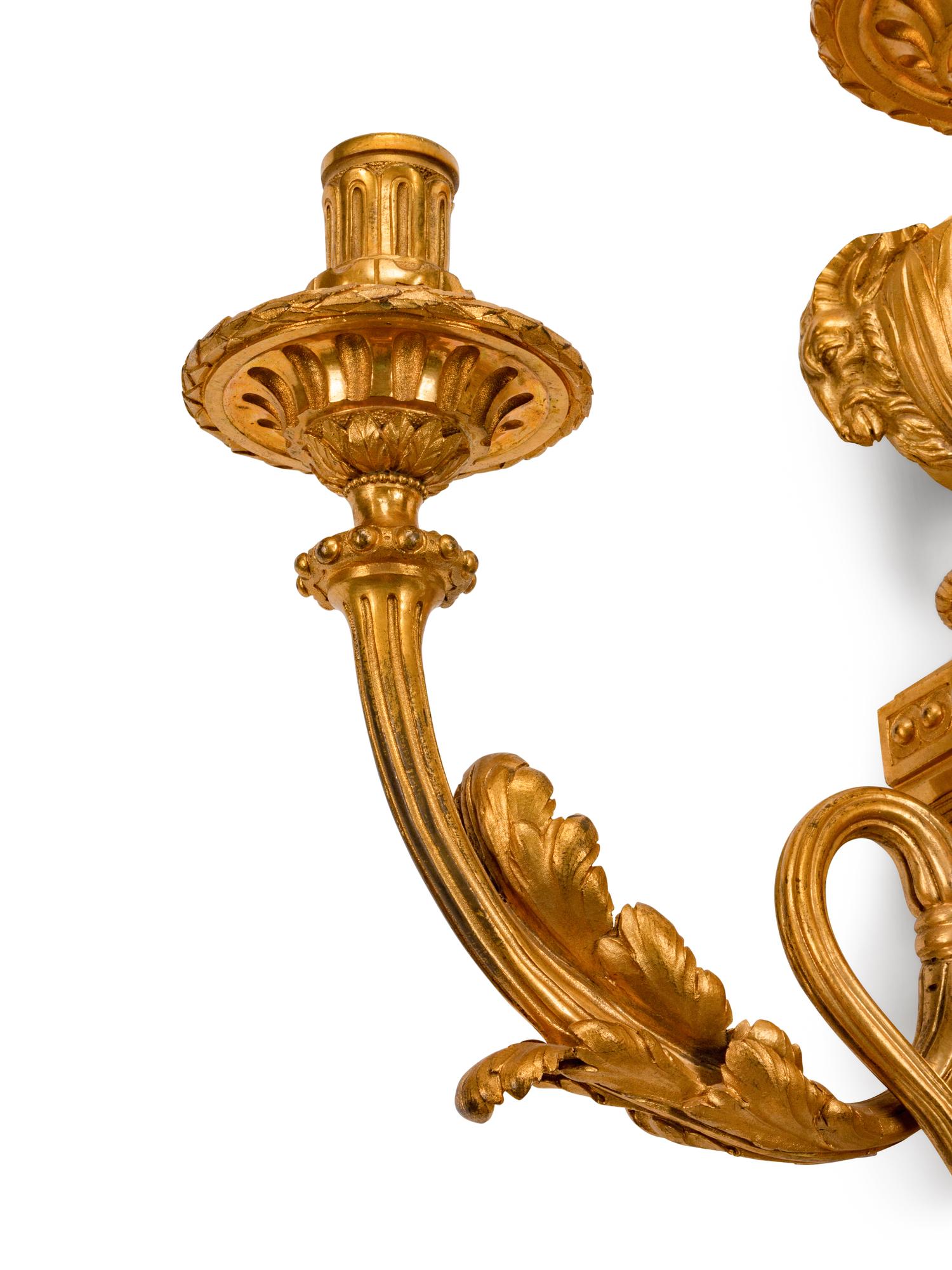 A Pair of Louis XVI Style Gilt-Bronze Three-Light Sconces