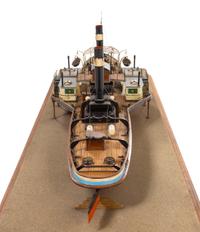 A Model of the Side Wheel Tug Munchen Height of model 14 x length of base 58 5/8 inches.
