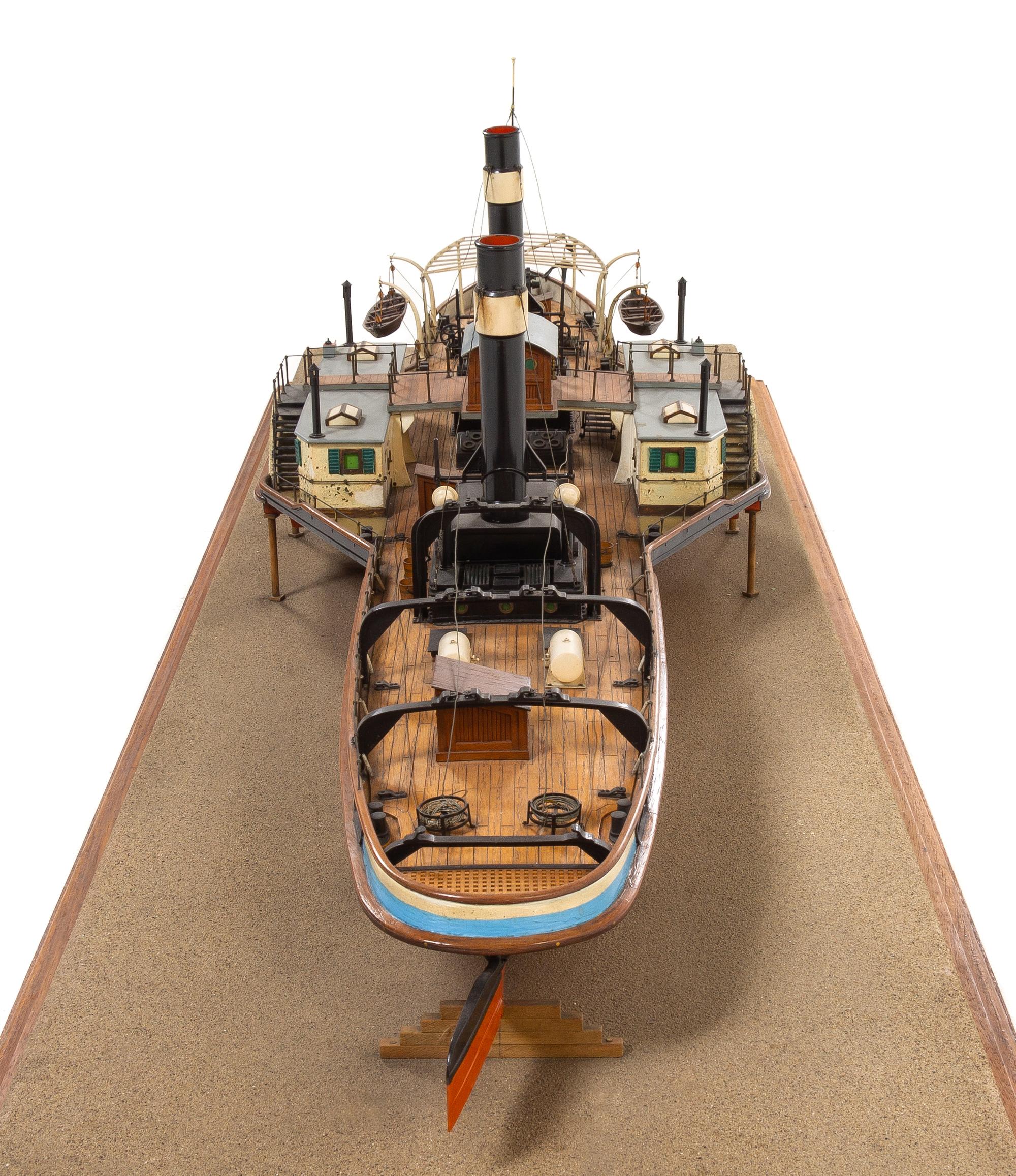 A Model of the Side Wheel Tug Munchen Height of model 14 x length of base 58 5/8 inches.