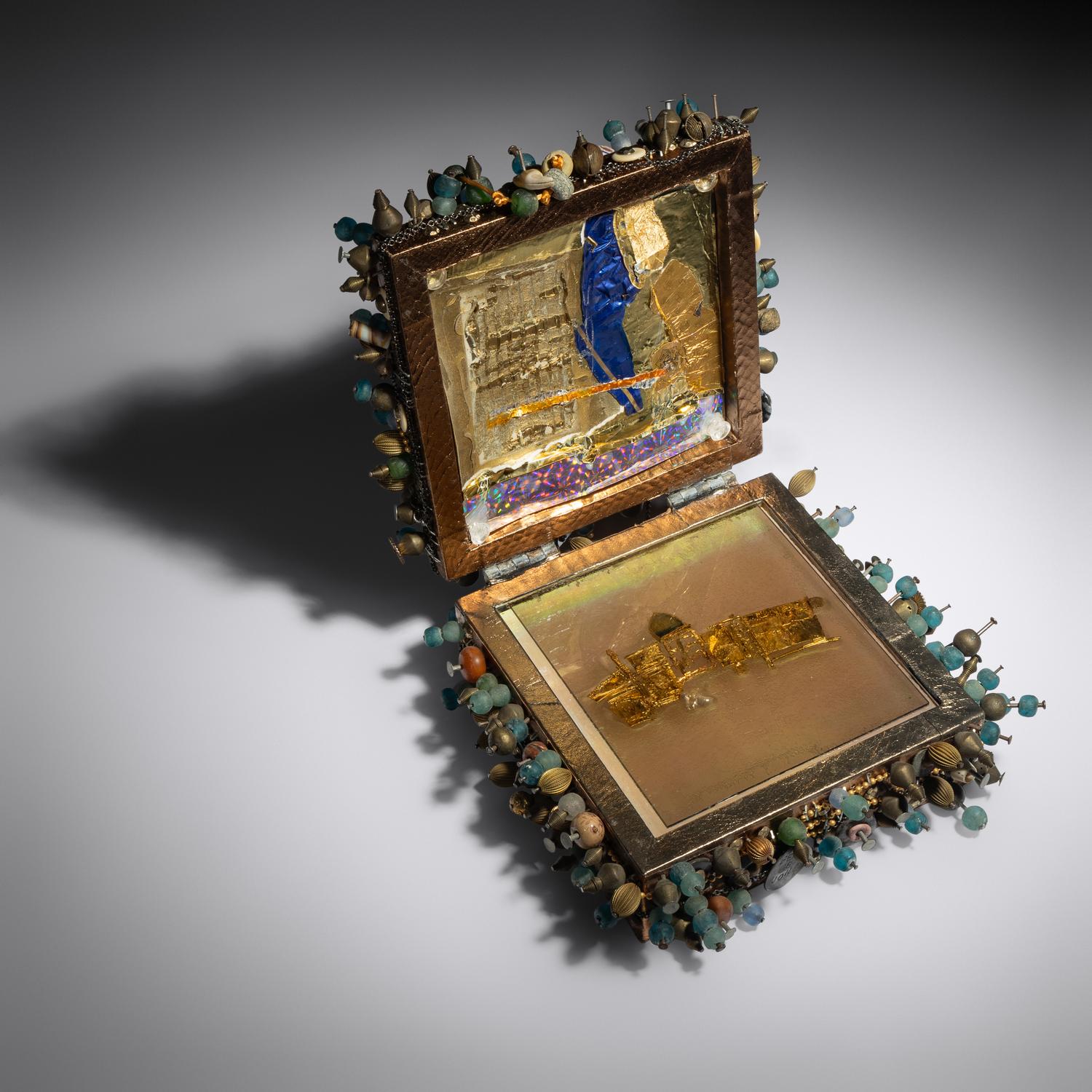 Cask with gold and gem brooch, 1998