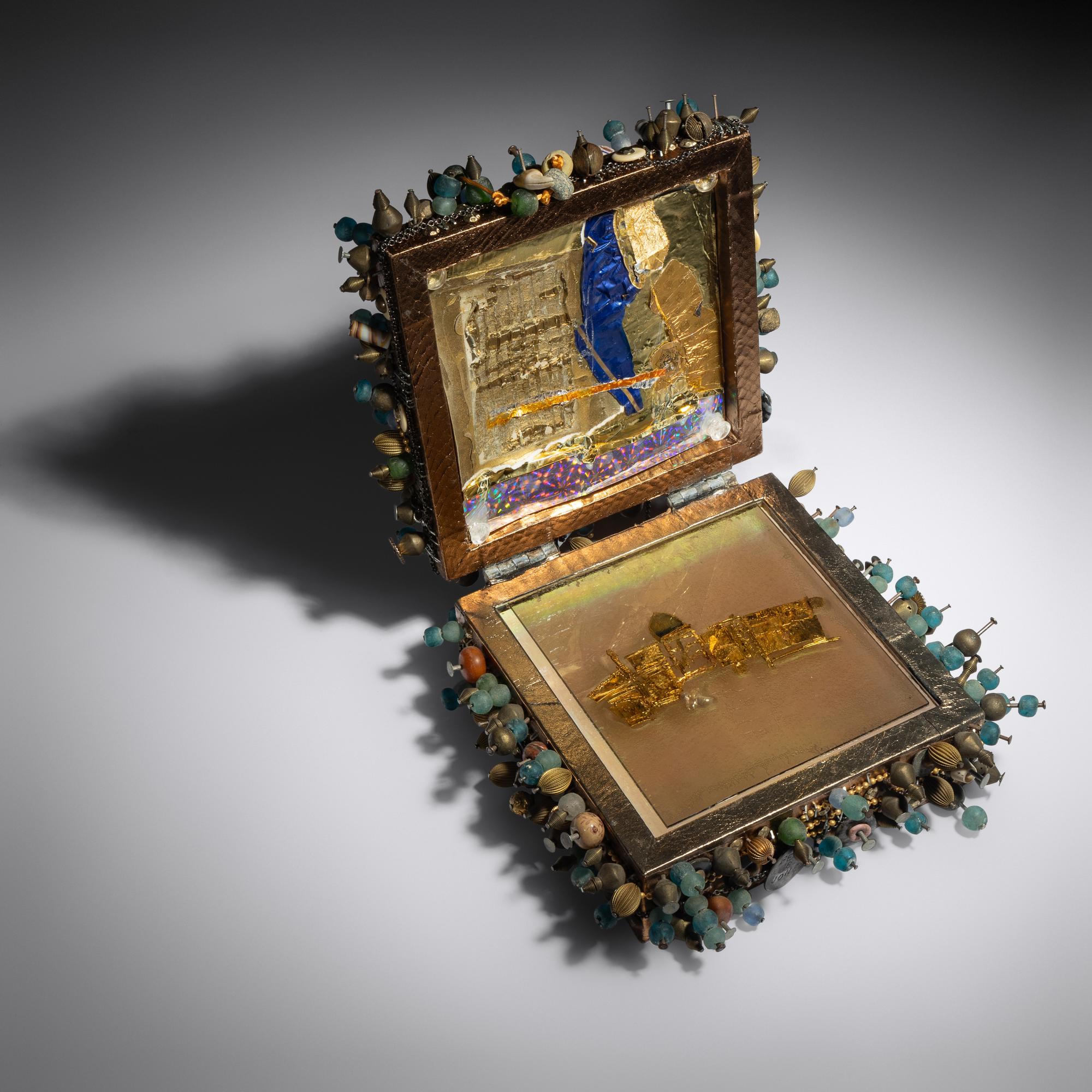 Cask with gold and gem brooch, 1998