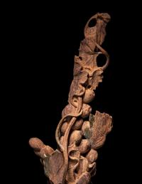 A Chinese Chenxiang Wood 'Squirrel and Grapes' Carving