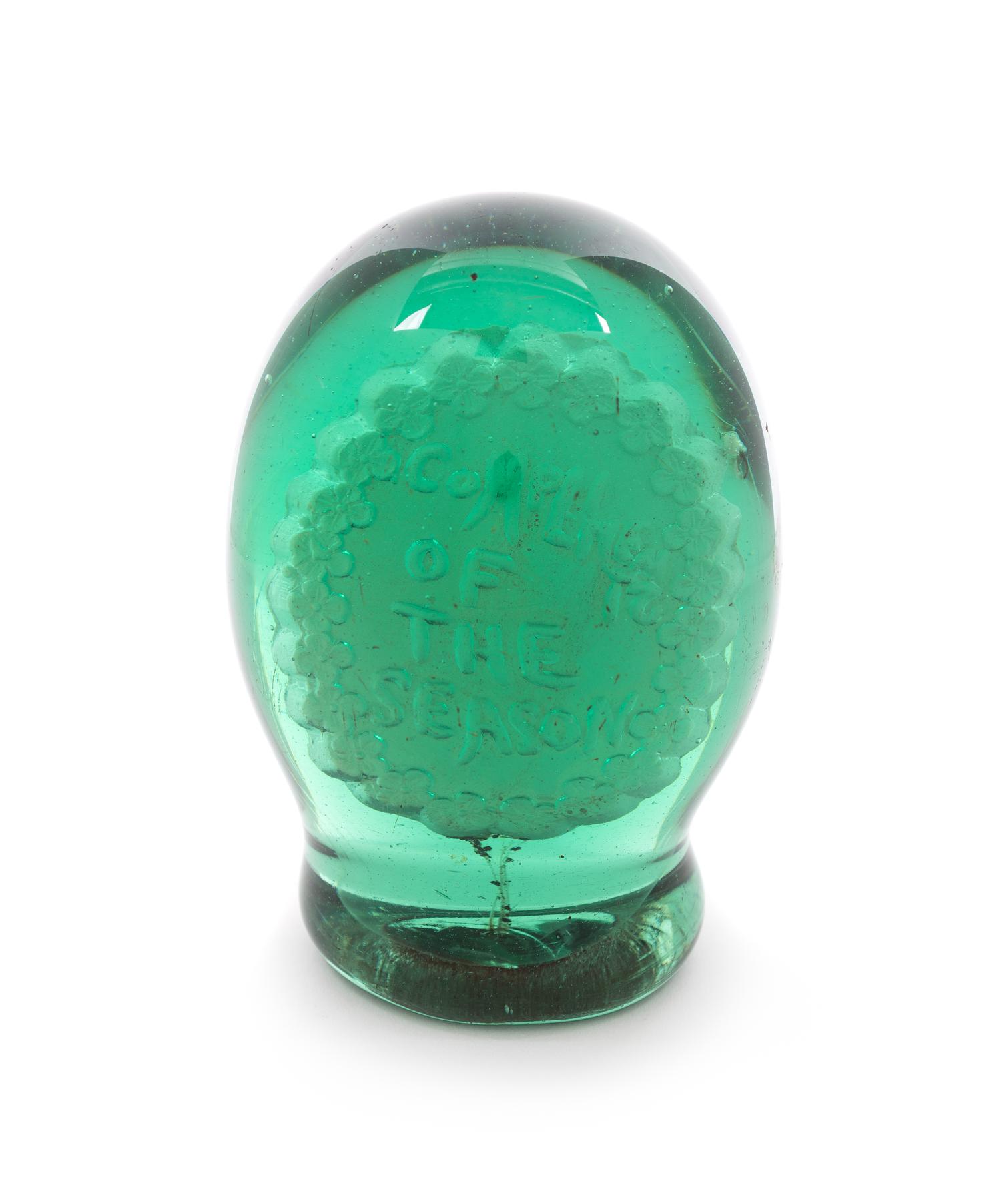 An Antique English Green Glass Sulphide Doorstop Diameter 2 1/2 inches