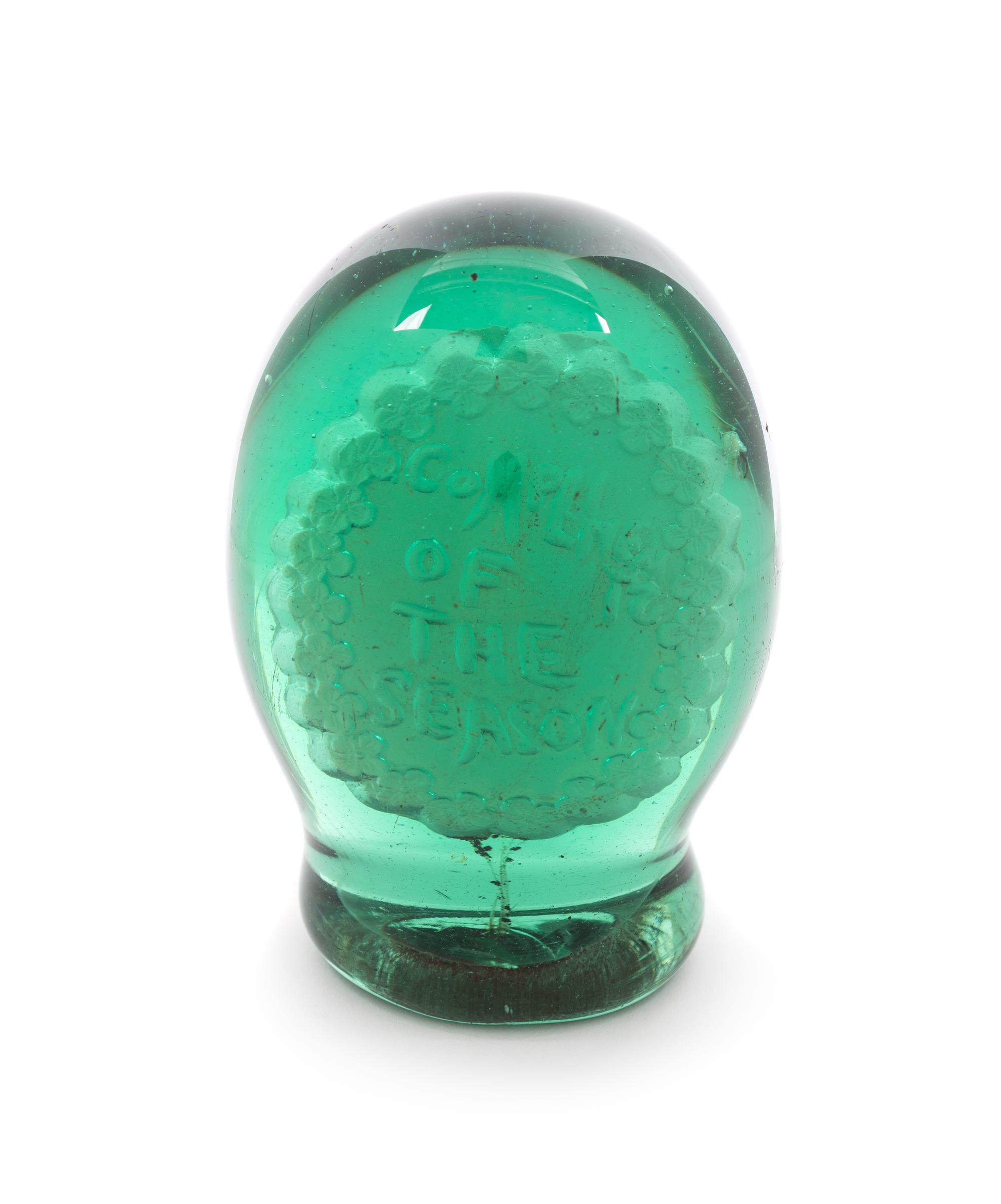 An Antique English Green Glass Sulphide Doorstop Diameter 2 1/2 inches